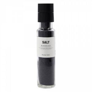 schwarzes Salz in einer Glasmühle